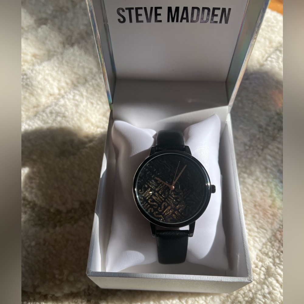 Black, rose inner face Steve Madden watch. Adjustable band